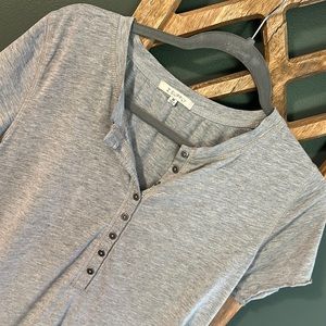 Like new. Soft t-shirt with button detail.